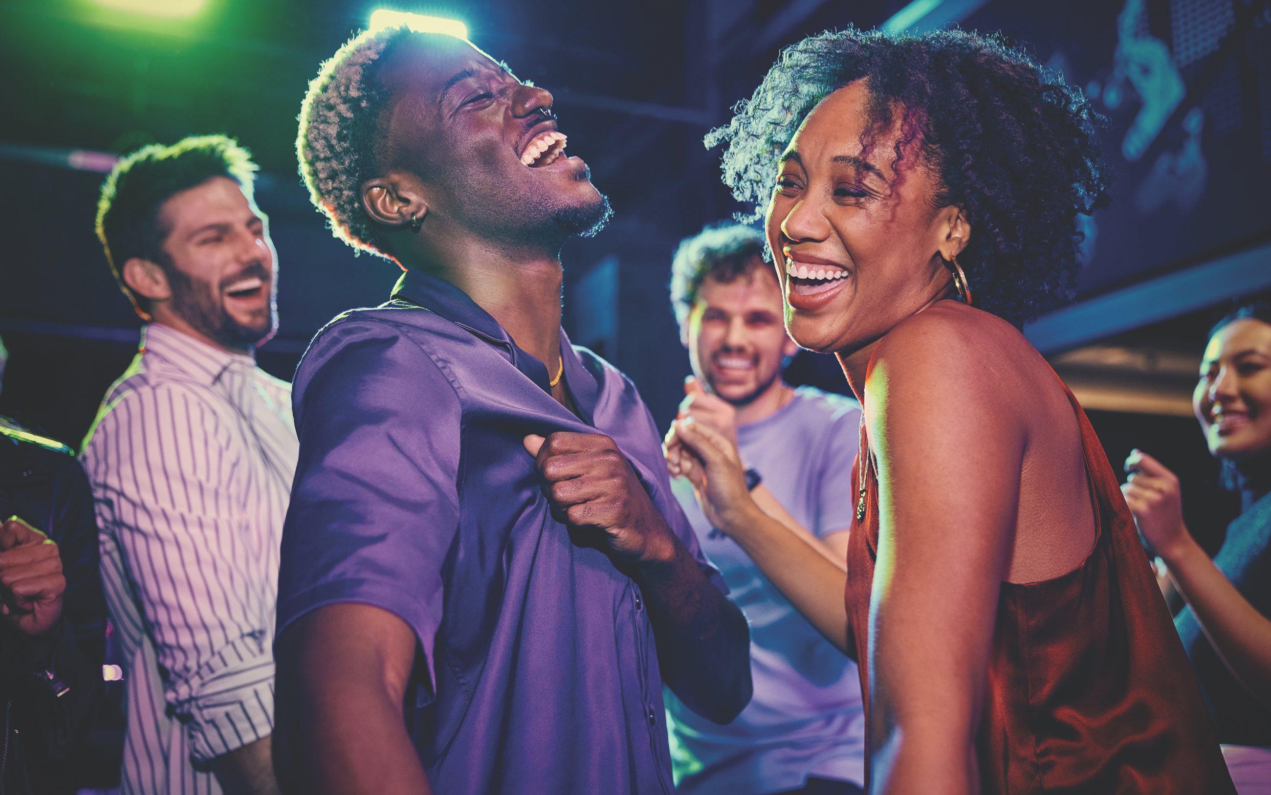 Young couple dancing and laughing 